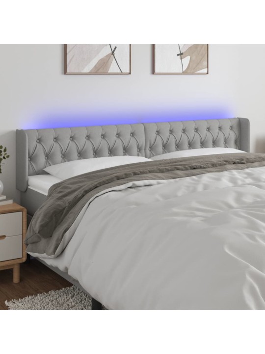Čelo postele s LED světle šedé 203 x 16 x 78/88 cm textil