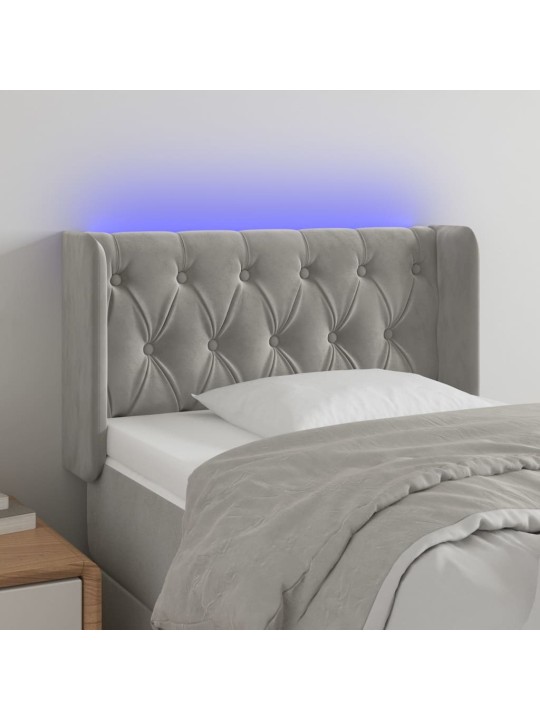 Čelo postele s LED světle šedé 83 x 16 x 78/88 cm samet