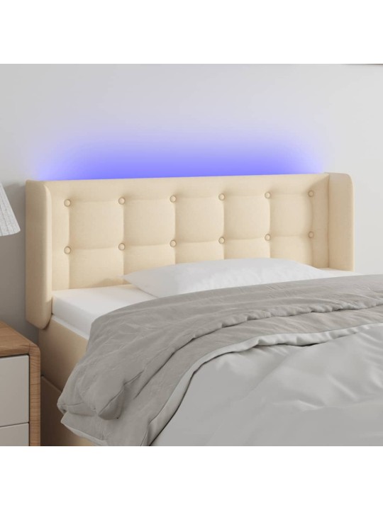 Čelo postele s LED krémové 103 x 16 x 78/88 cm textil