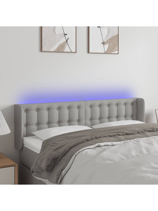 Čelo postele s LED světle šedé 147 x 16 x 78/88 cm textil