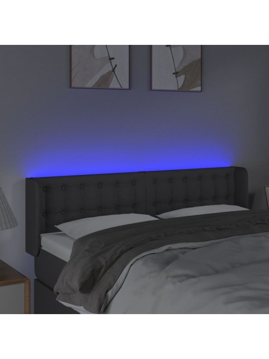 Čelo postele s LED tmavě šedé 147 x 16 x 78/88 cm textil