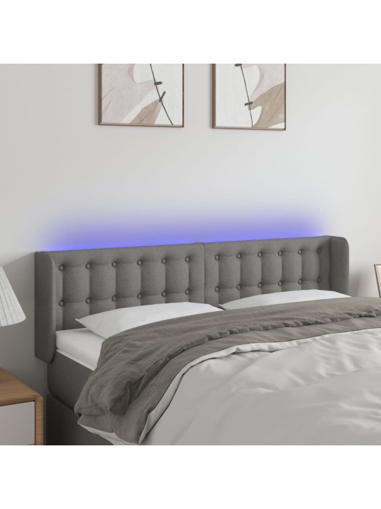 Čelo postele s LED tmavě šedé 147 x 16 x 78/88 cm textil