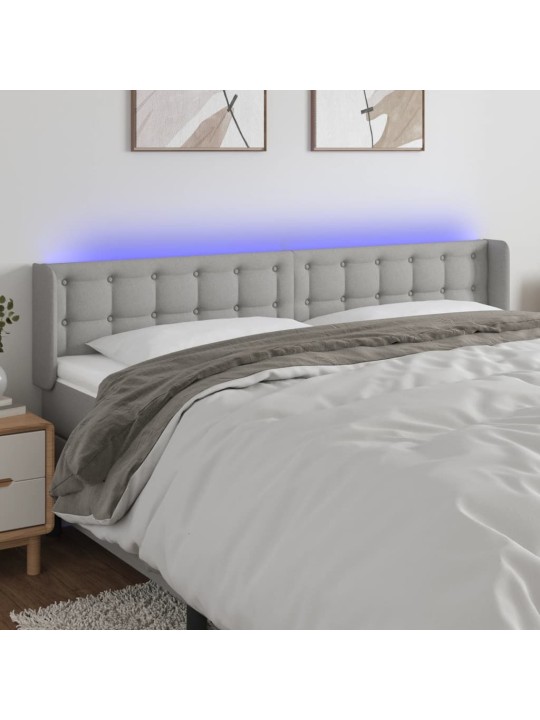 Čelo postele s LED světle šedé 203 x 16 x 78/88 cm textil