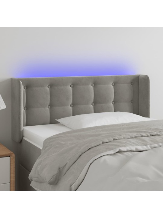 Čelo postele s LED světle šedé 83 x 16 x 78/88 cm samet