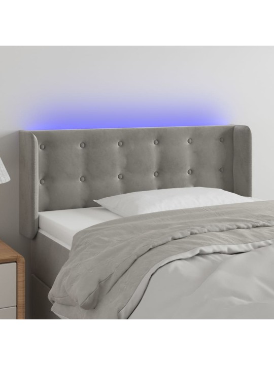 Čelo postele s LED světle šedé 103 x 16 x 78/88 cm samet