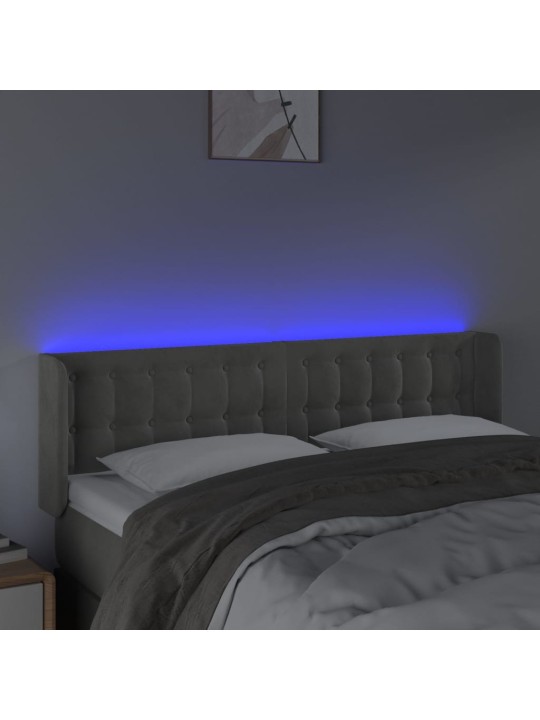 Čelo postele s LED světle šedé 147 x 16 x 78/88 cm samet