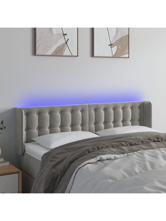 Čelo postele s LED světle šedé 147 x 16 x 78/88 cm samet