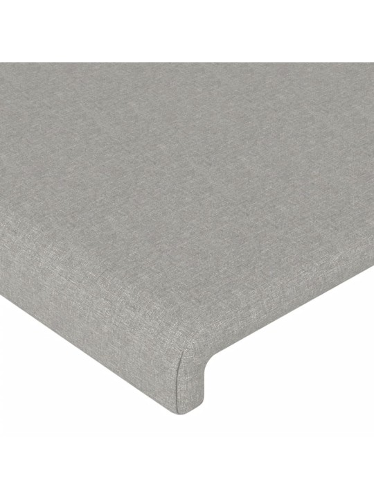 Čelo postele s LED světle šedé 83 x 16 x 118/128 cm textil