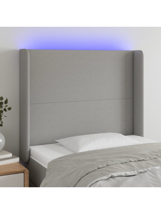 Čelo postele s LED světle šedé 83 x 16 x 118/128 cm textil