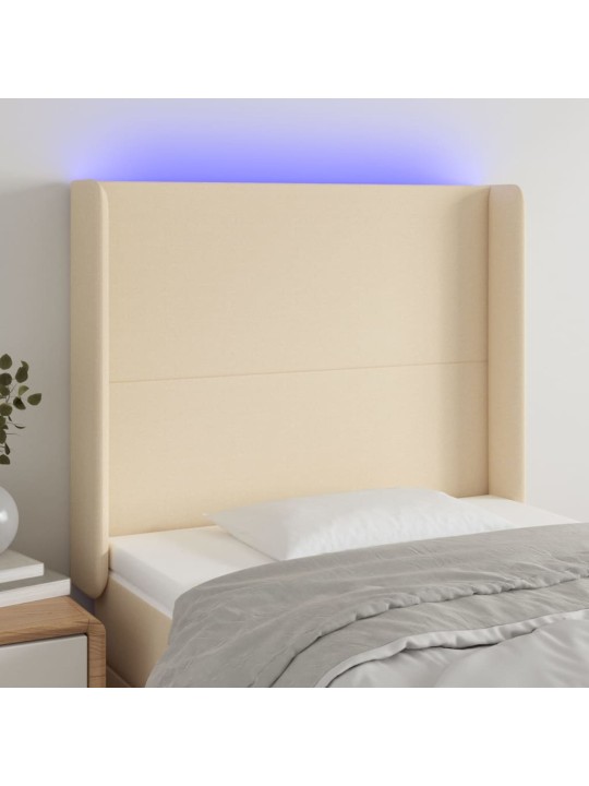 Čelo postele s LED krémové 83 x 16 x 118/128 cm textil
