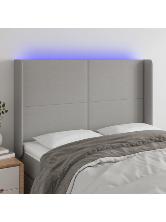 Čelo postele s LED světle šedé 147x16x118/128 cm textil