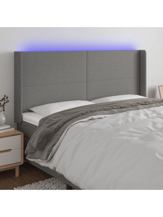 Čelo postele s LED tmavě šedé 163 x 16 x 118/128 cm textil