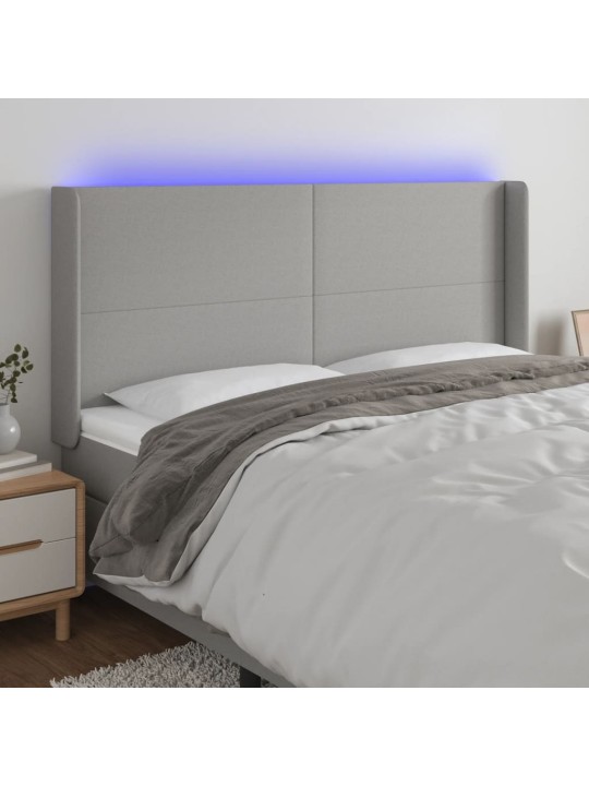 Čelo postele s LED světle šedé 183x16x118/128 cm textil