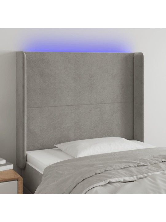 Čelo postele s LED světle šedé 83 x 16 x 118/128 cm samet