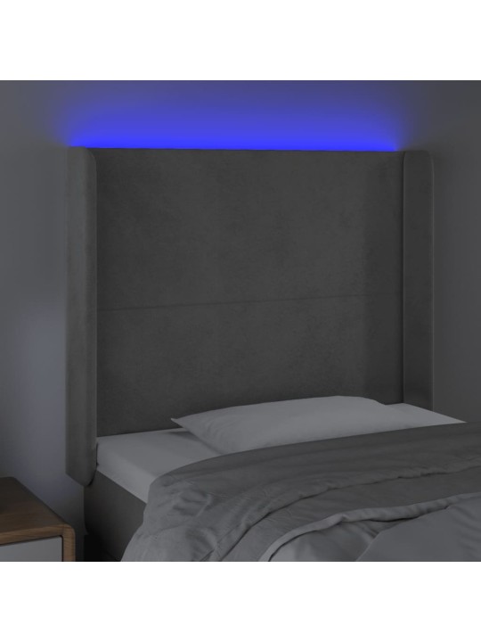 Čelo postele s LED světle šedé 103 x 16 x 118/128 cm samet