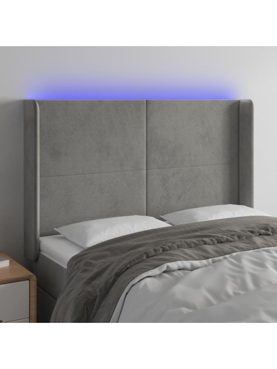 Čelo postele s LED světle šedé 147x16x118/128 cm samet