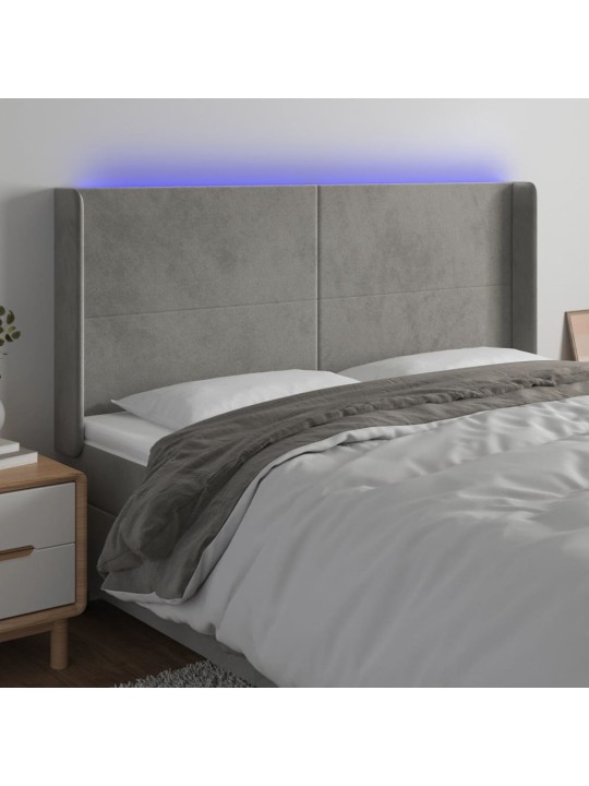 Čelo postele s LED světle šedé 203 x 16 x 118/128 cm samet