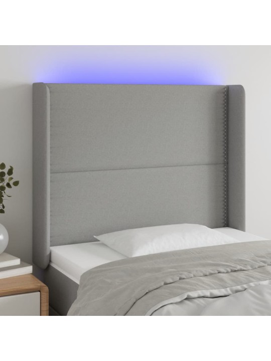 Čelo postele s LED světle šedé 83 x 16 x 118/128 cm textil