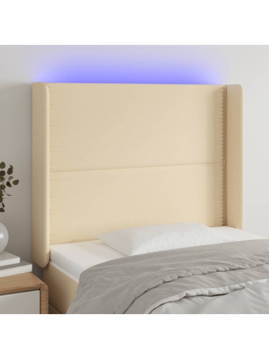 Čelo postele s LED krémové 103 x 16 x 118/128 cm textil