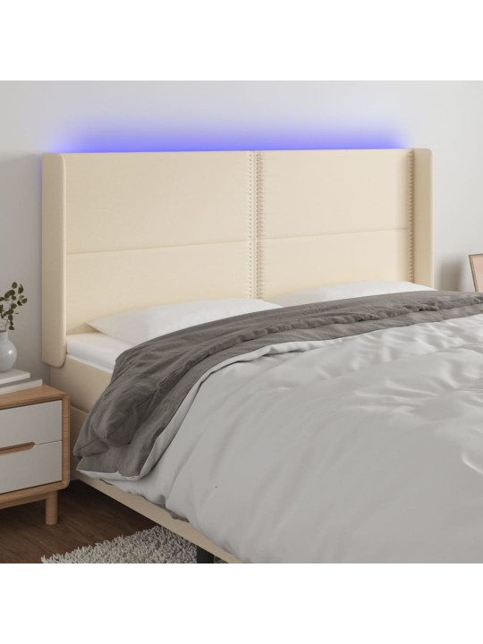 Čelo postele s LED krémové 183 x 16 x 118/128 cm textil