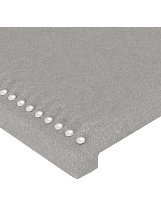 Čelo postele s LED světle šedé 203x16x118/128 cm textil