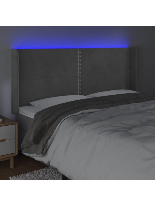 Čelo postele s LED světle šedé 183 x 16 x 118/128 cm samet