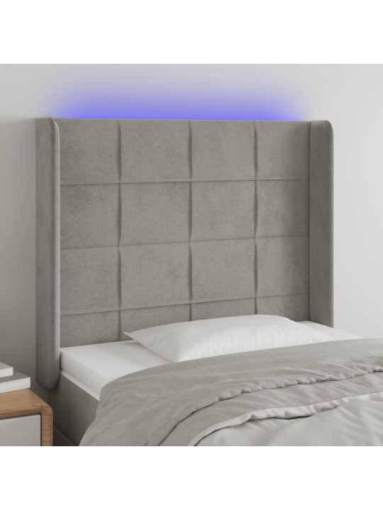 Čelo postele s LED světle šedé 103 x 16 x 118/128 cm samet