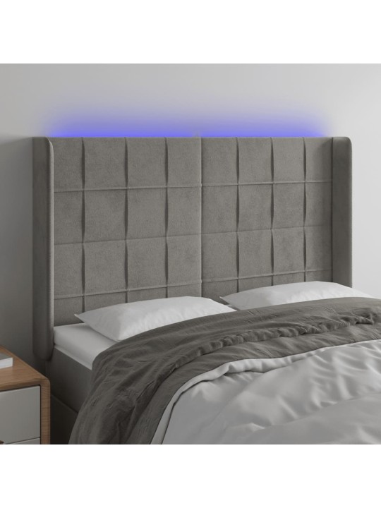 Čelo postele s LED světle šedé 147x16x118/128 cm samet