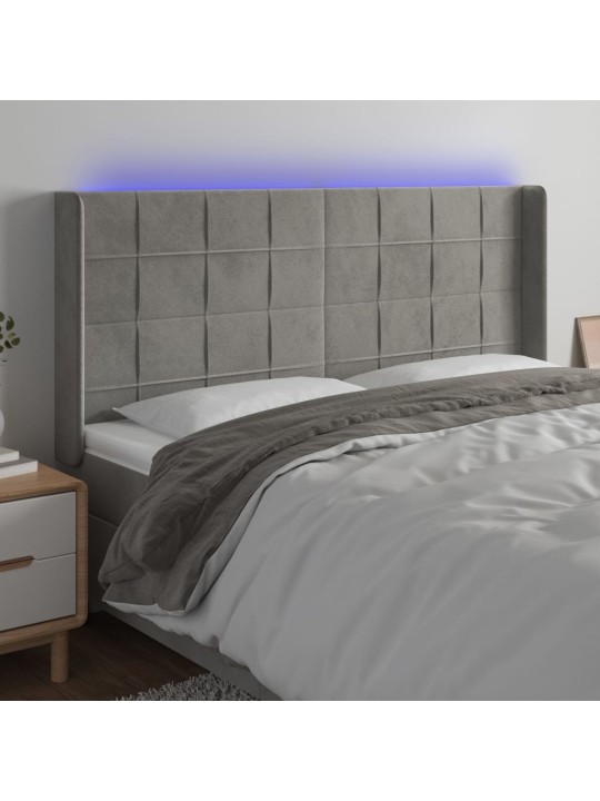 Čelo postele s LED světle šedé 183 x 16 x 118/128 cm samet