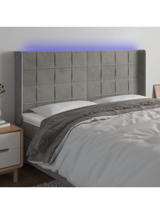 Čelo postele s LED světle šedé 203 x 16 x 118/128 cm samet