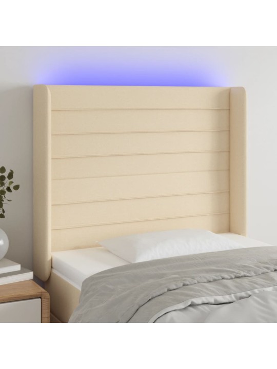 Čelo postele s LED krémové 83 x 16 x 118/128 cm textil