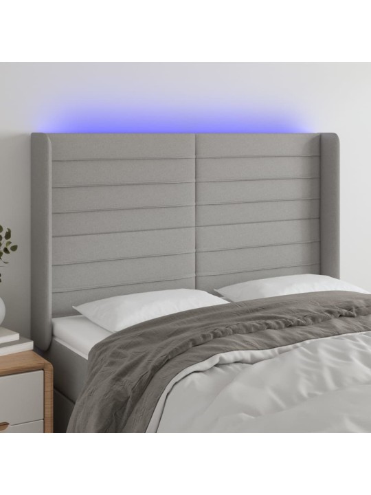 Čelo postele s LED světle šedé 147x16x118/128 cm textil
