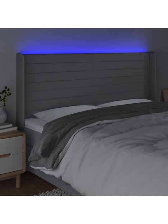 Čelo postele s LED světle šedé 203x16x118/128 cm textil