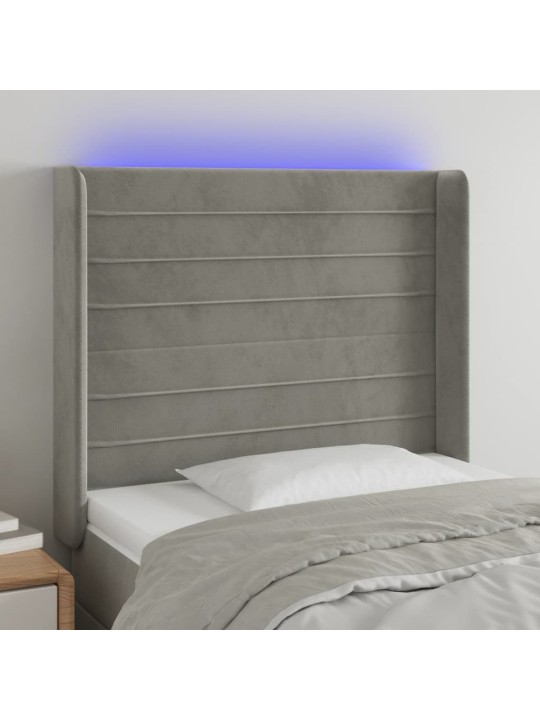 Čelo postele s LED světle šedé 83 x 16 x 118/128 cm samet