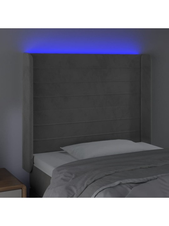 Čelo postele s LED světle šedé 103 x 16 x 118/128 cm samet