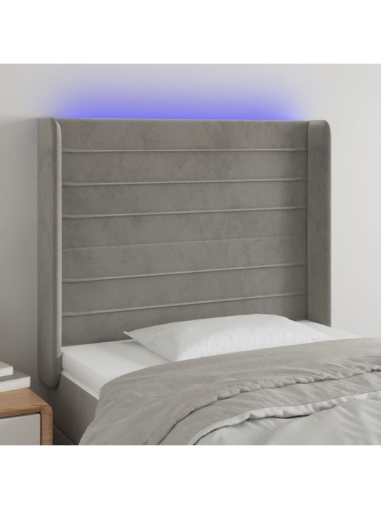 Čelo postele s LED světle šedé 103 x 16 x 118/128 cm samet