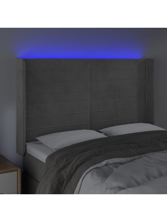 Čelo postele s LED světle šedé 147x16x118/128 cm samet