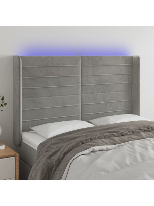 Čelo postele s LED světle šedé 147x16x118/128 cm samet