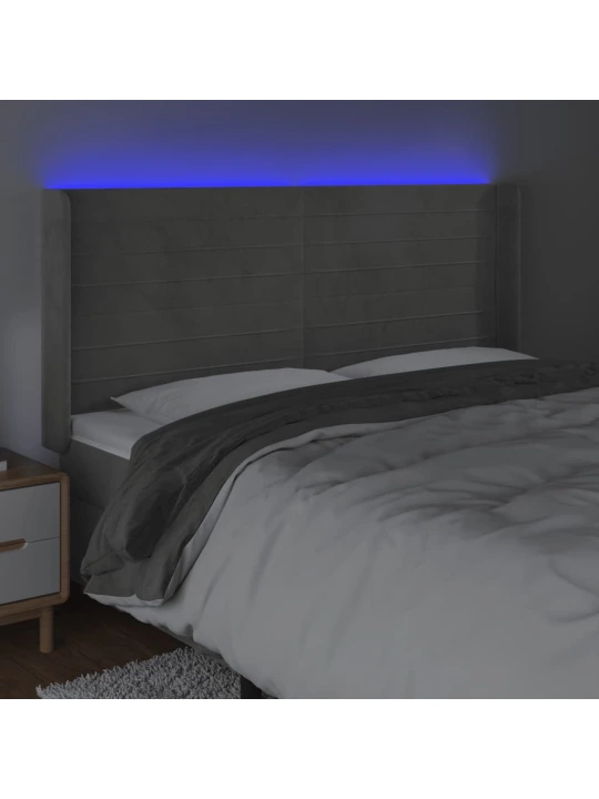 Čelo postele s LED světle šedé 163 x 16 x 118/128 cm samet