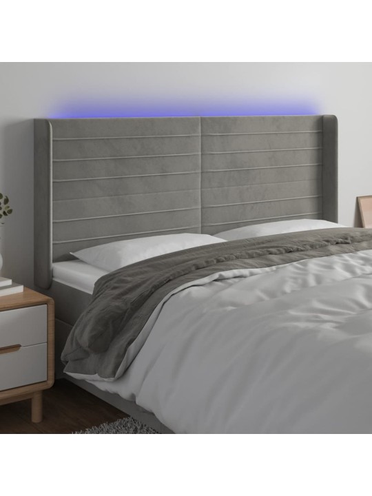 Čelo postele s LED světle šedé 183 x 16 x 118/128 cm samet