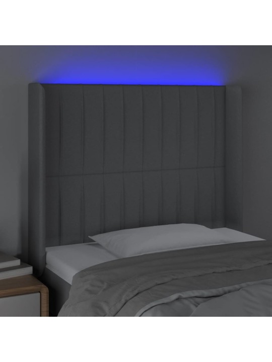 Čelo postele s LED světle šedé 83 x 16 x 118/128 cm textil