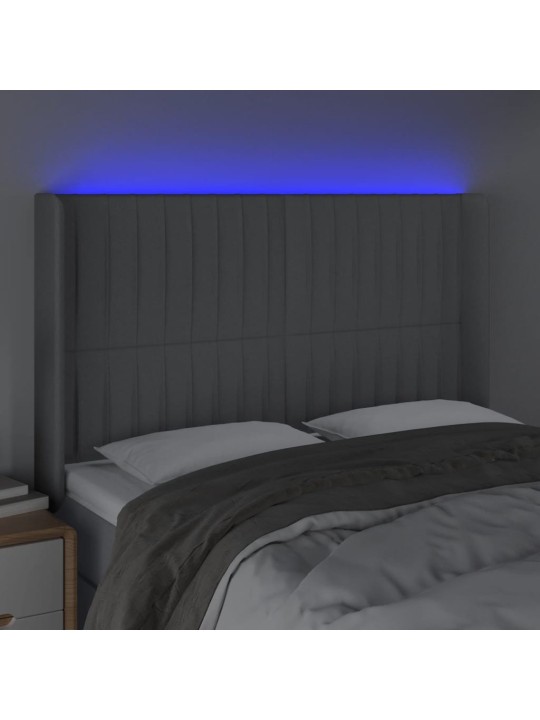Čelo postele s LED světle šedé 147x16x118/128 cm textil