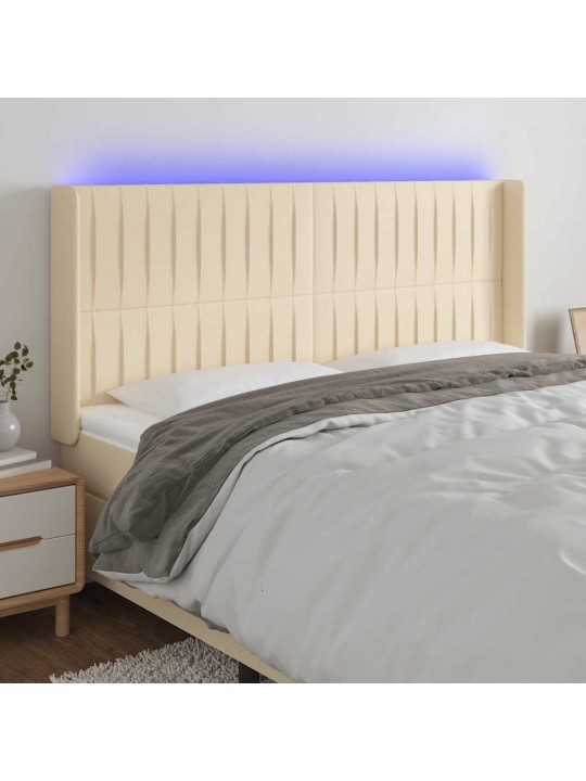 Čelo postele s led krémové 203 x 16 x 118/128 cm textil