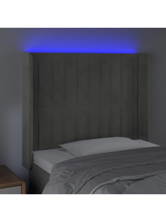 Čelo postele s LED světle šedé 103 x 16 x 118/128 cm samet