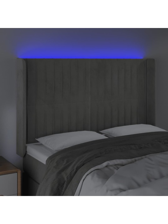 Čelo postele s LED světle šedé 147x16x118/128 cm samet