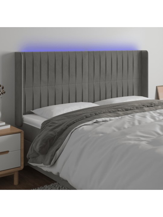 Čelo postele s LED světle šedé 183 x 16 x 118/128 cm samet