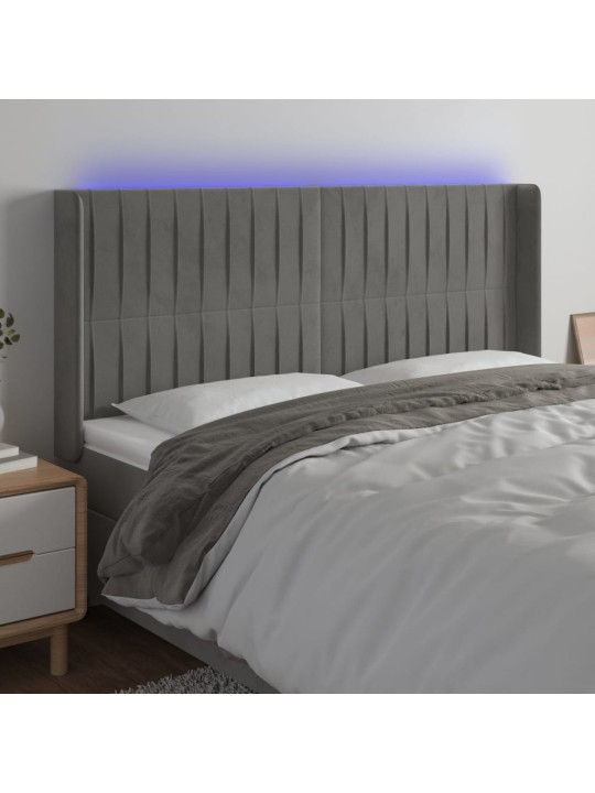 Čelo postele s LED světle šedé 203 x 16 x 118/128 cm samet