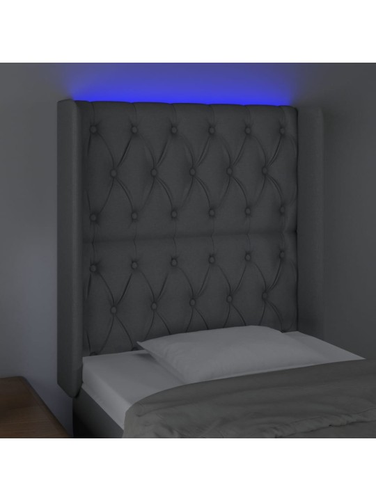 Čelo postele s LED světle šedé 83 x 16 x 118/128 cm textil