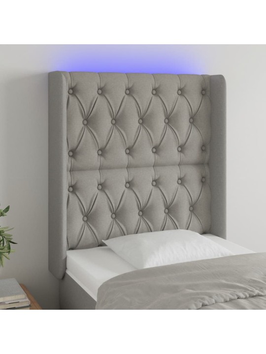 Čelo postele s LED světle šedé 83 x 16 x 118/128 cm textil