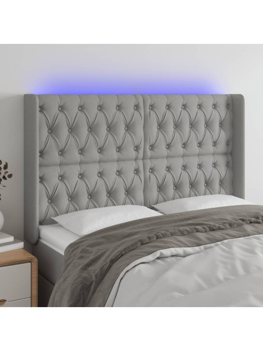 Čelo postele s LED světle šedé 147x16x118/128 cm textil
